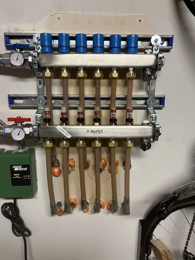 Plumber performing Water Heater Repair at a residential property in Bacliff